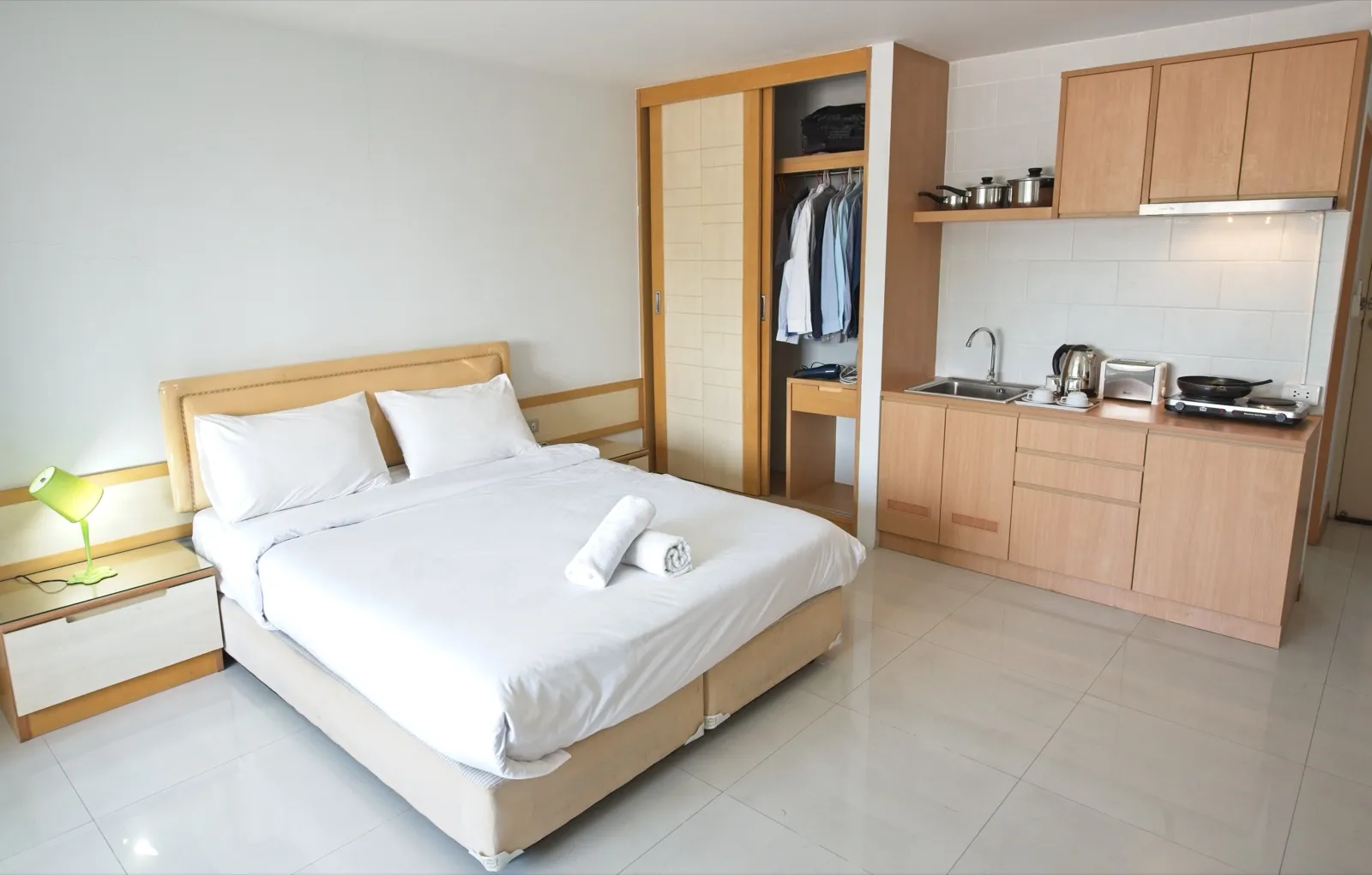 Deluxe 44 sqm bedroom with the kitchenette and wardrobe along one wall